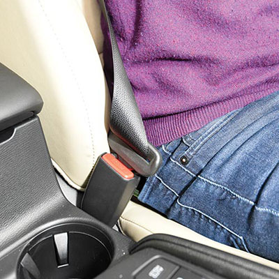 Occupant sitting on seat belt